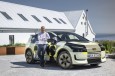 Dr. Moni Islam in front of the Audi A2 e-tron with design livery